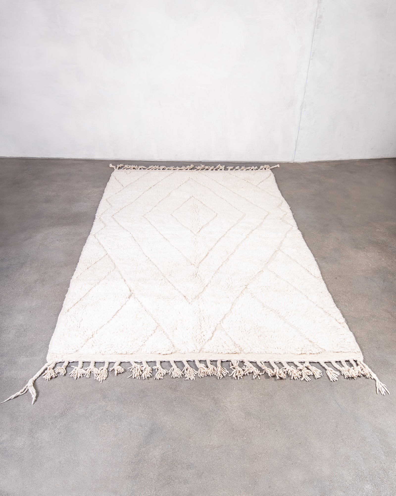 Modern, designer, handcrafted Berber rug from Morocco. Beniourain carpet with beautiful colours and patterns and fluffy wool texture.